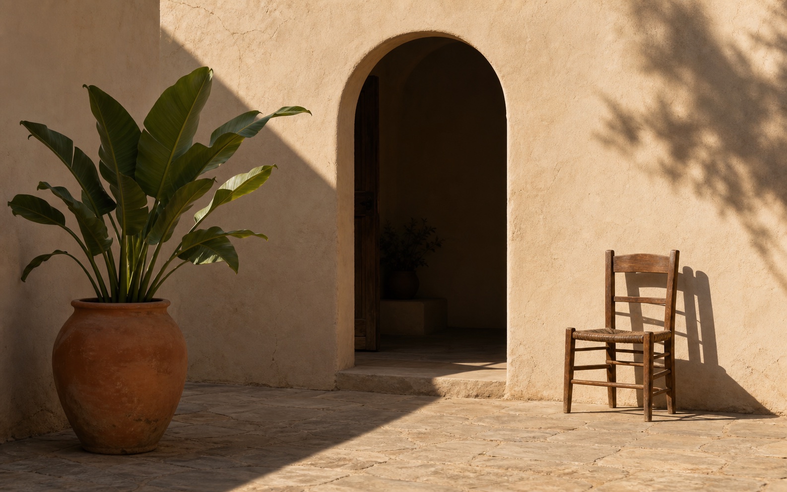 A sunlit adobe courtyard compared with one indigo value group isolated and the value boundaries outlined.