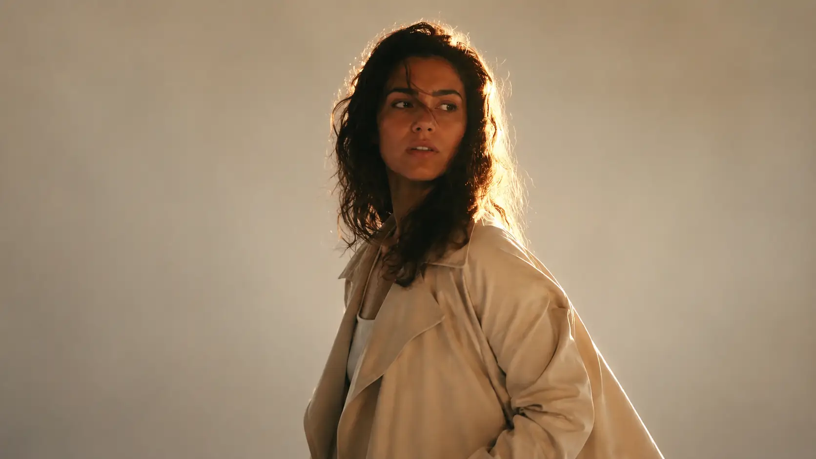 Background removal comparison showing a backlit person with loose hair against a brighter window scene. overlay